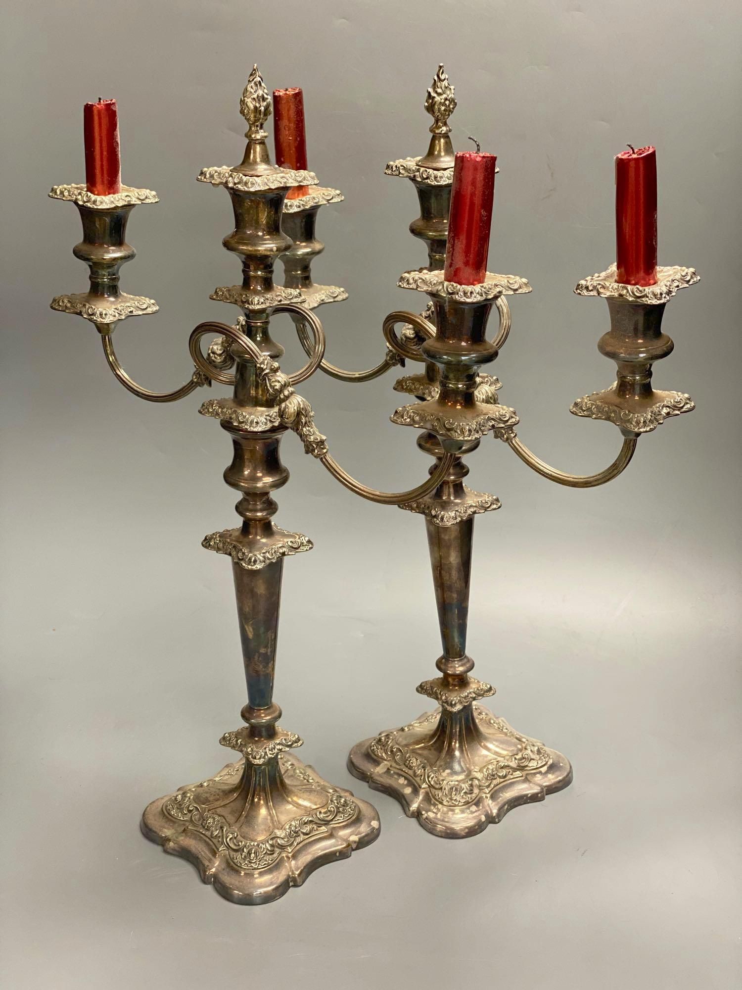 A pair of silver plated candelabra, three sconce candelabra, 51cm